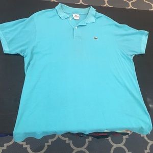EUC blue short sleeve polo by Lacoste